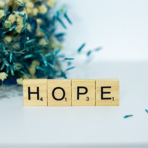 scrabble tiles that spell out hope