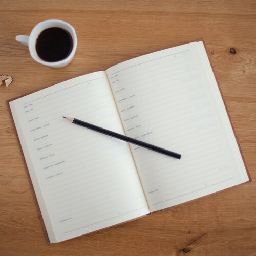 notebook with coffee cup